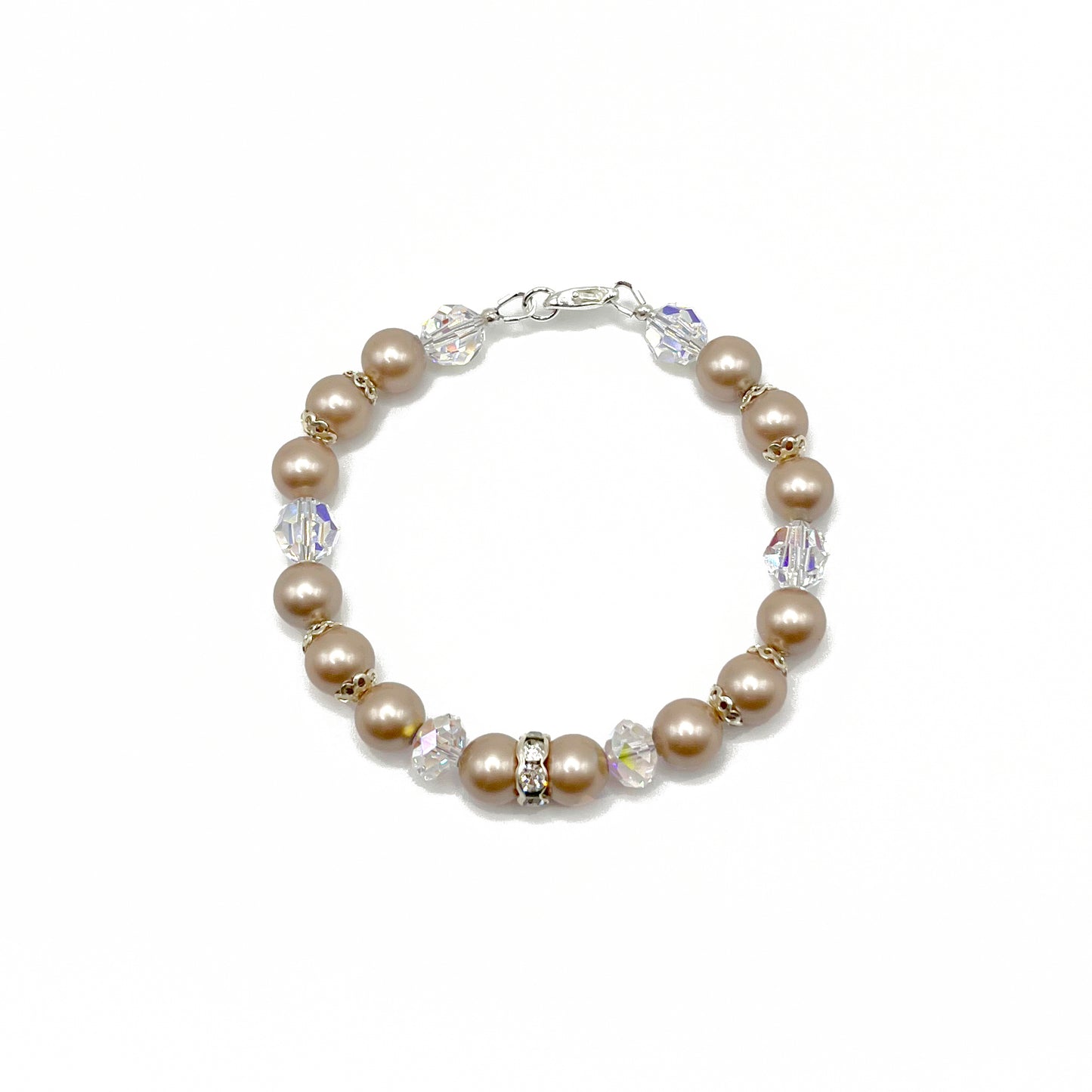 Almond-colored pearl bracelet with sterling silver accents, hand-strung for effortless elegance.