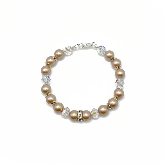 Almond-colored pearl bracelet with sterling silver accents, hand-strung for effortless elegance.
