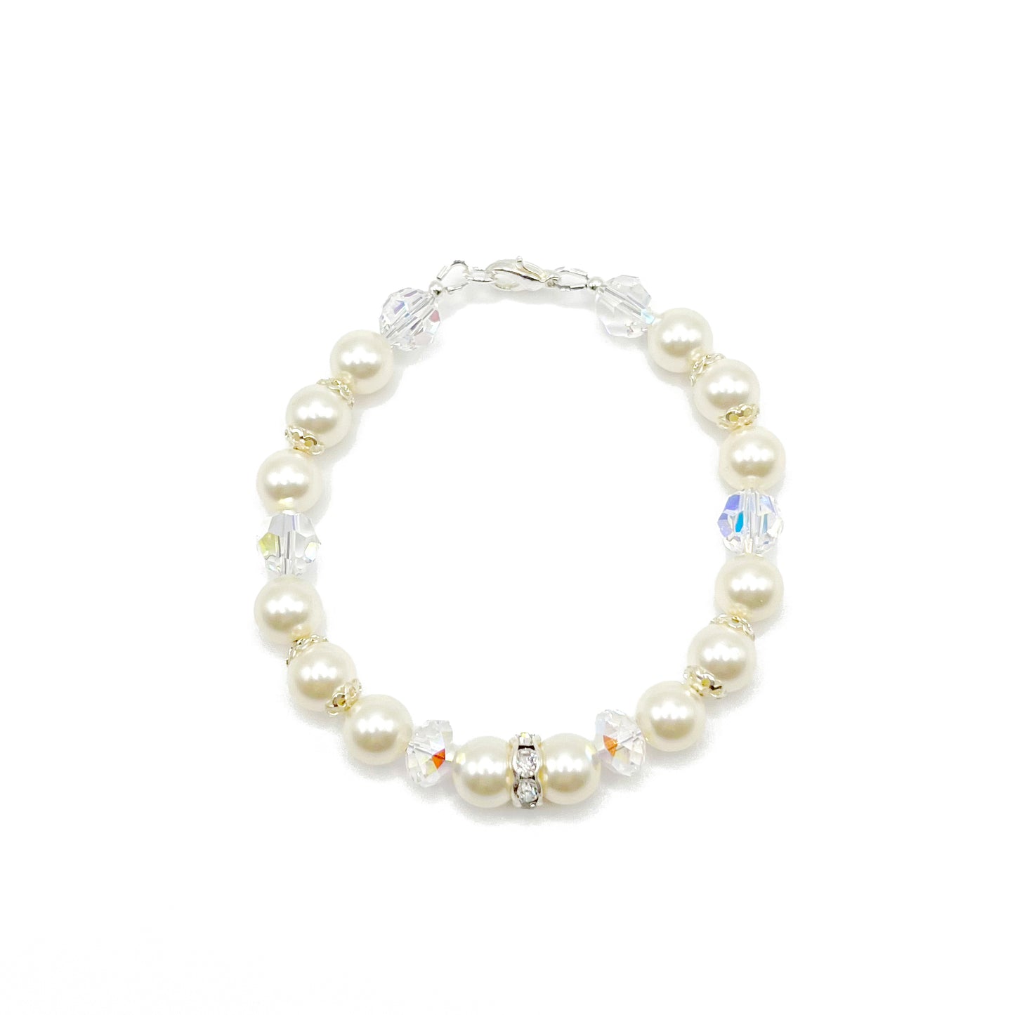 Cream-toned crystal pearl bracelet with sterling silver accents, classic and warm in tone.