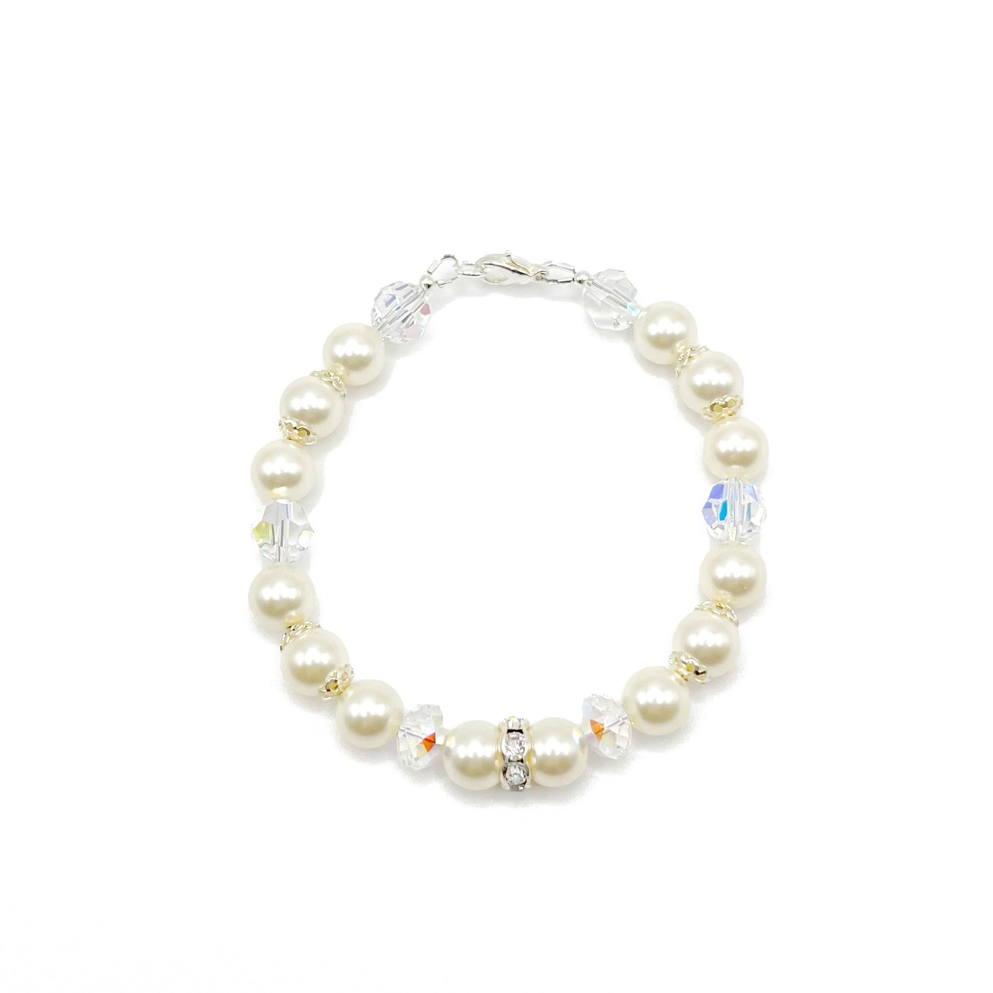 Cream-toned crystal pearl bracelet with sterling silver accents, classic and warm in tone.